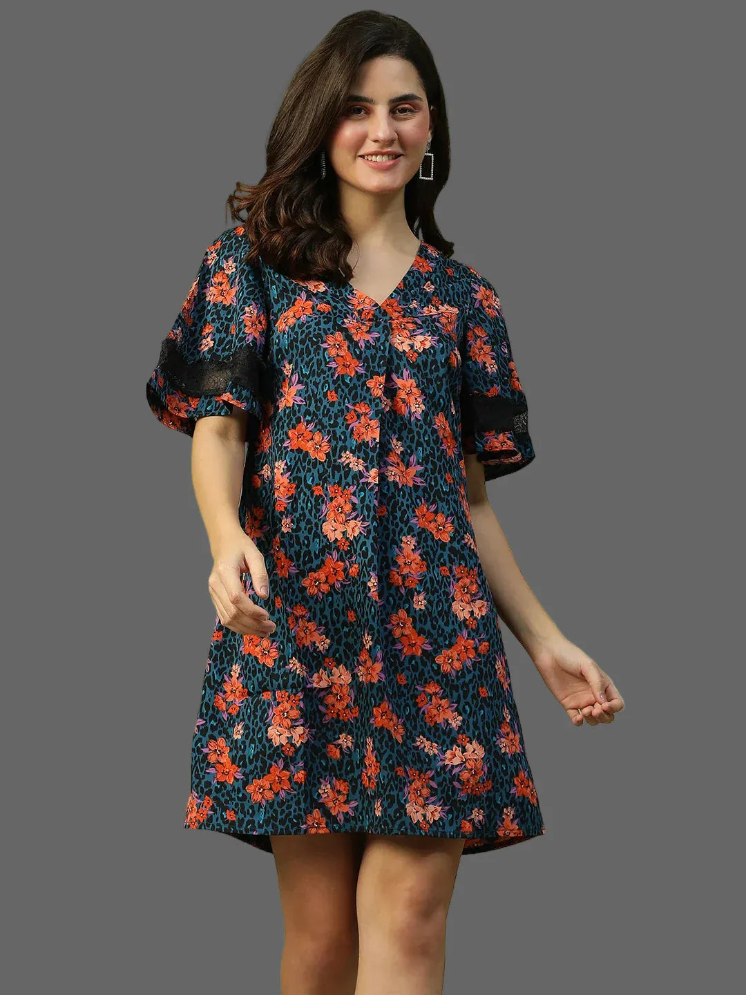 Woman wearing a floral dress on a plain background