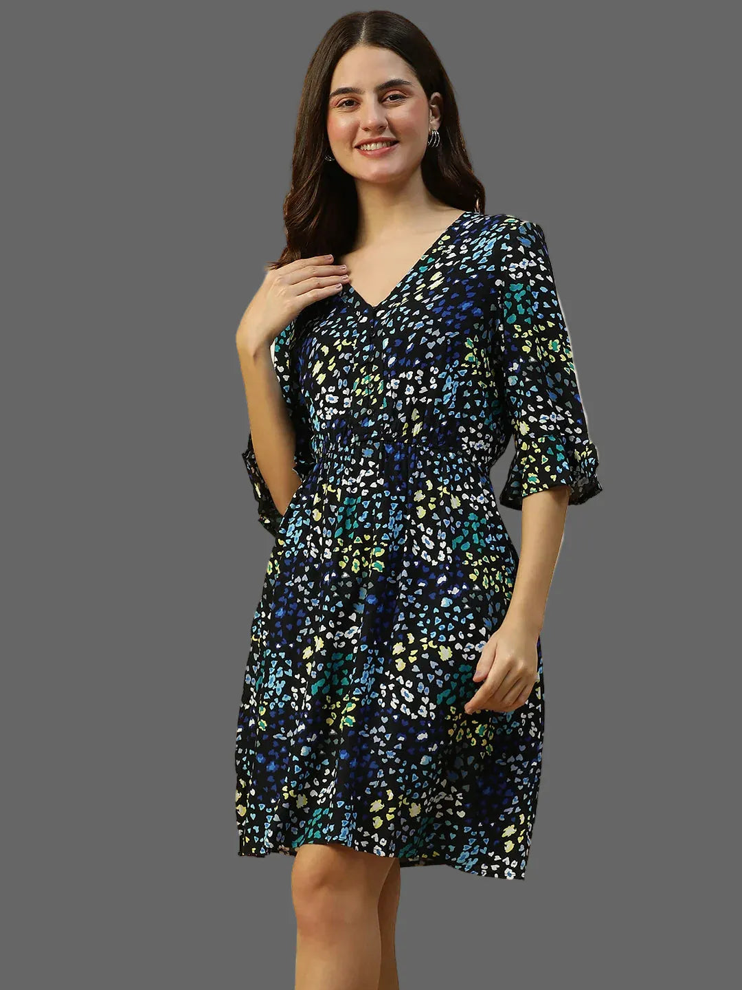 Woman wearing a floral dress on a plain background