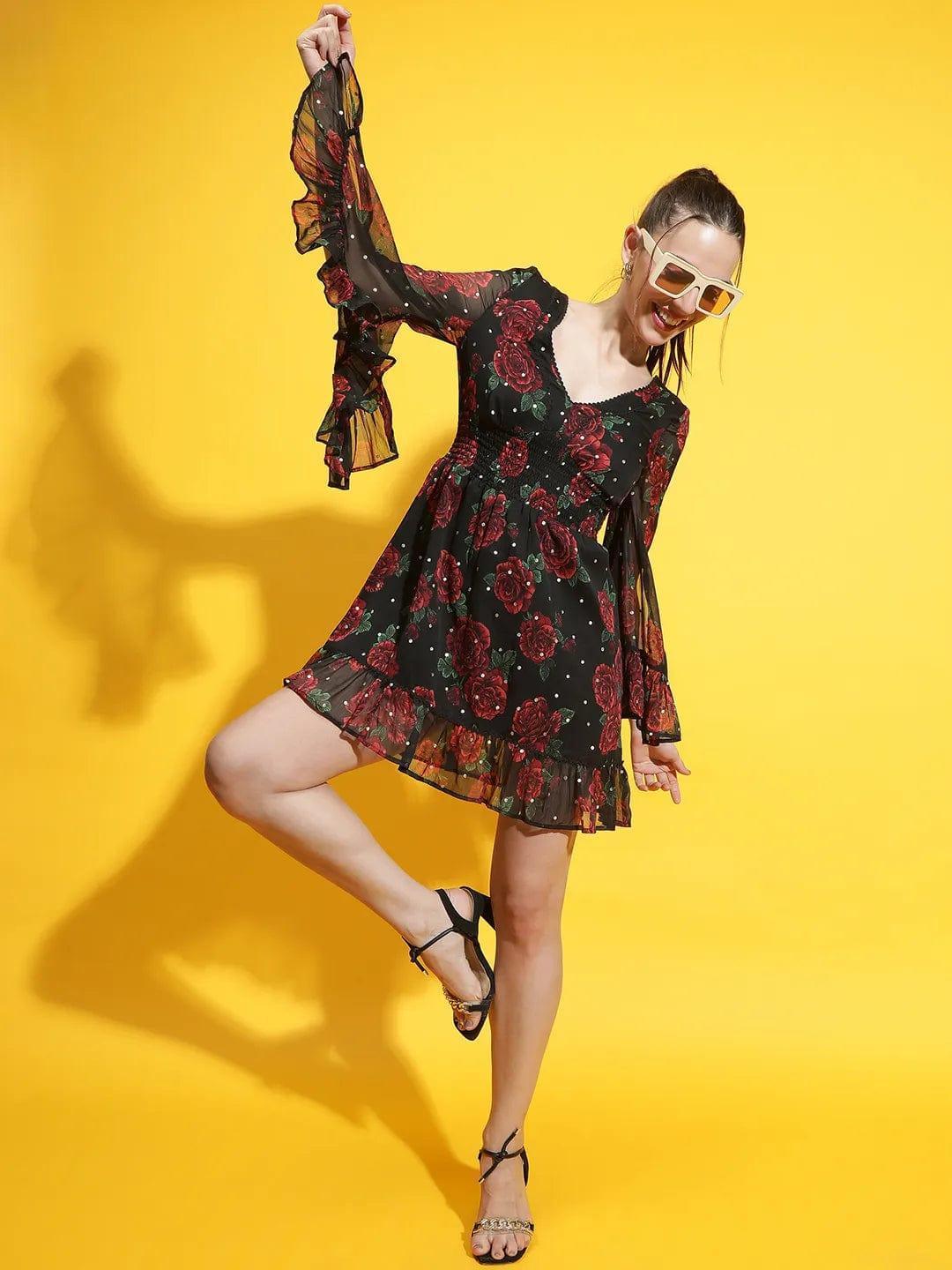 Oxolloxo black rose print lace dress with sheer long sleeves and ruffle hem on model