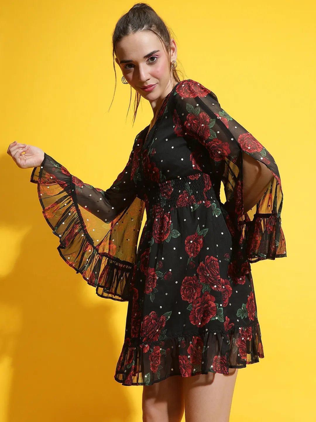 Oxolloxo black rose print lace dress with sheer bell sleeves and ruffled hem on model