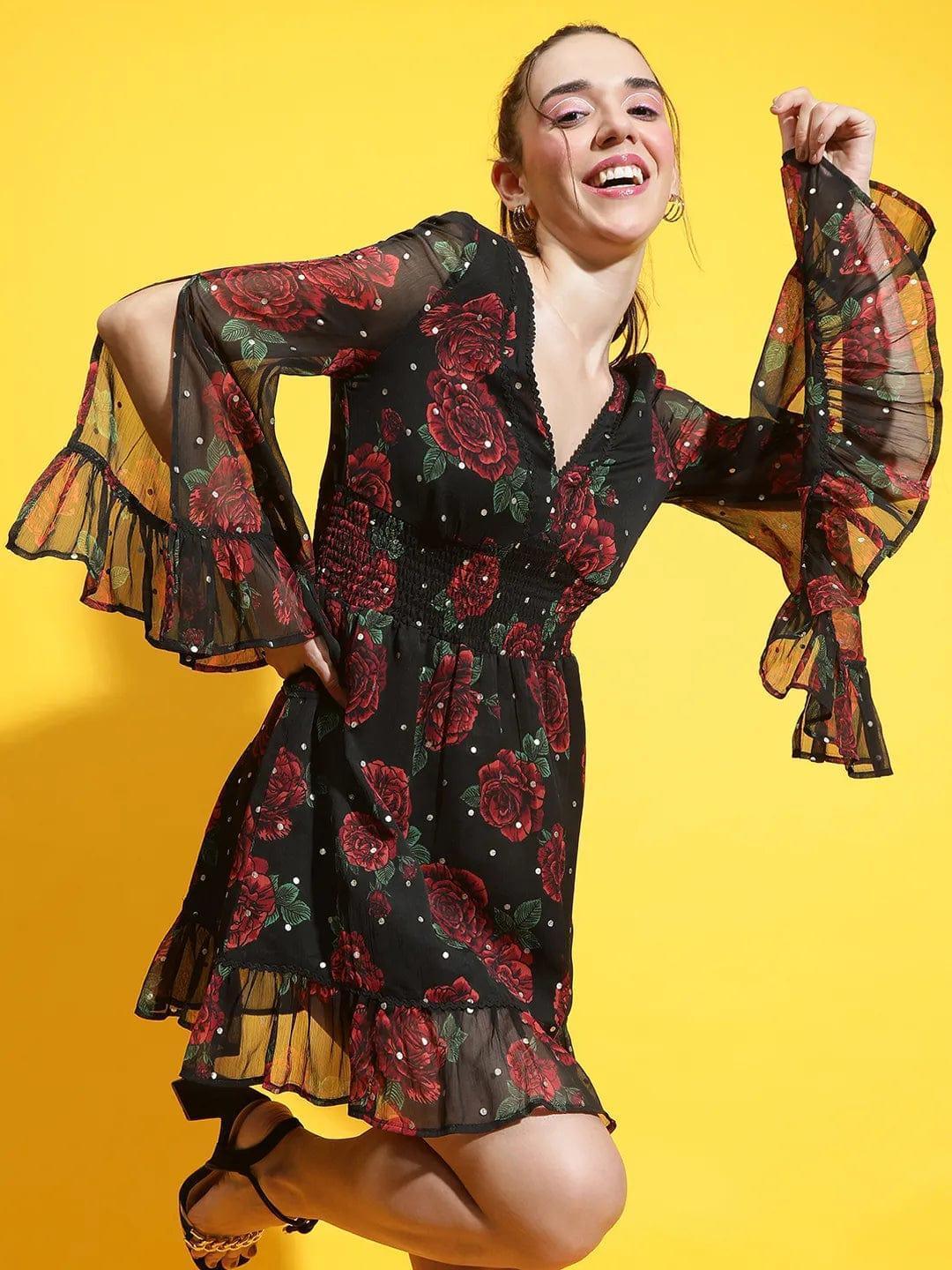 Oxolloxo black rose print lace dress with sheer bell sleeves and ruffled hem worn by smiling woman