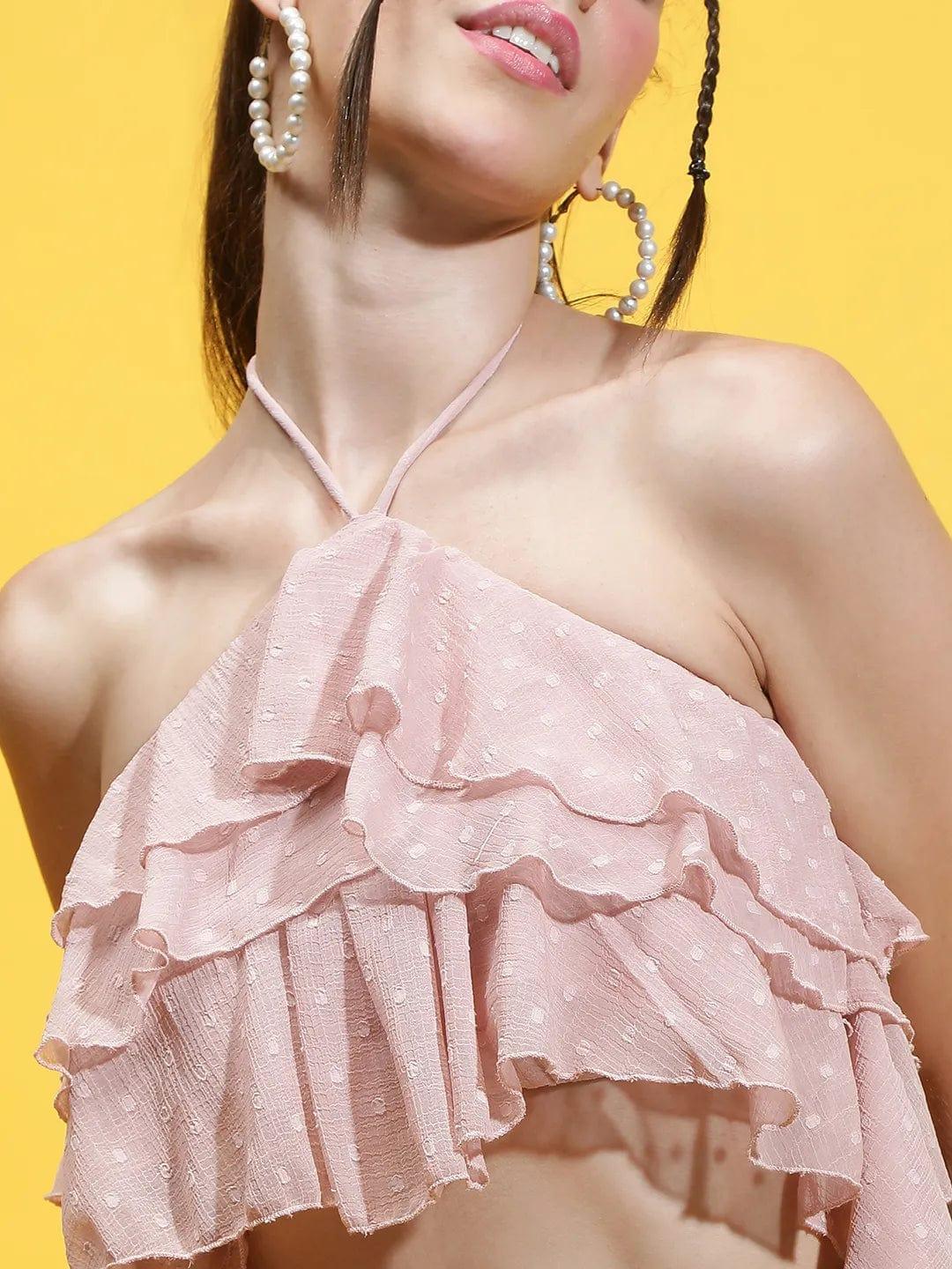 Oxolloxo pink halter neck crop top with ruffled layers and textured fabric on model